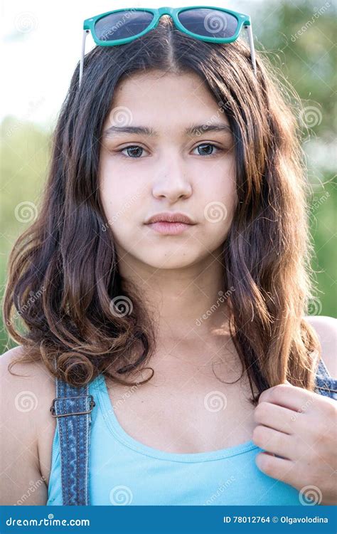 Portrait Of Beautiful Teen Girl With Sunglasses On Head Stock Photo