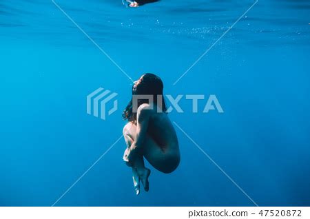 Naked Woman Swim In Sea Underwater In Ocean Stock Photo