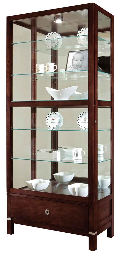 Curio cabinets feature glass panels on the sides and front doors which allows for a full view display. Howard Miller Williamson 680-515 Curio Cabinet - The Clock ...