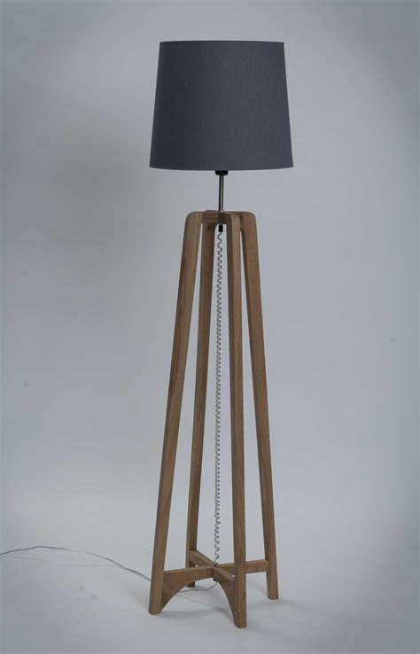 A tall pole or other way to elevate upward from the ground so that light can be placed higher in the room Curlew Floor Lamp - Natural | pr home