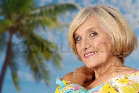 older woman on vacation in the summer stock image colourbox