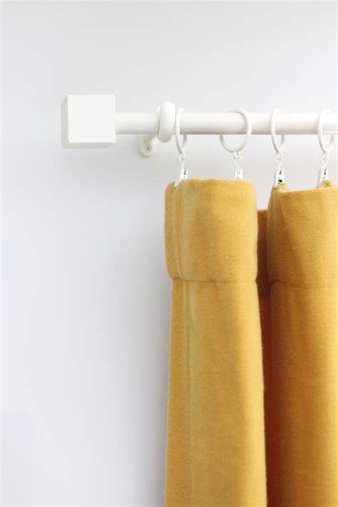 Make a diy curtain rod for less than $10. Budget Curtain Rod & Finial DIY - A Beautiful Mess