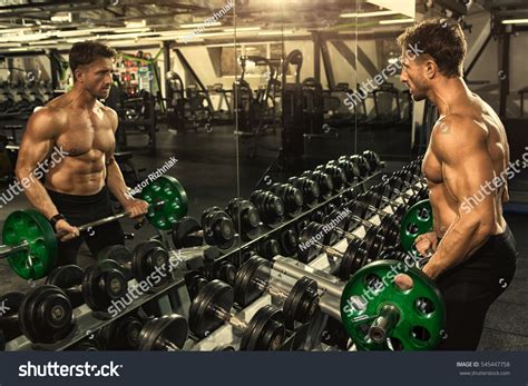 Shaping His Biceps Horizontal Shot Muscular Shutterstock