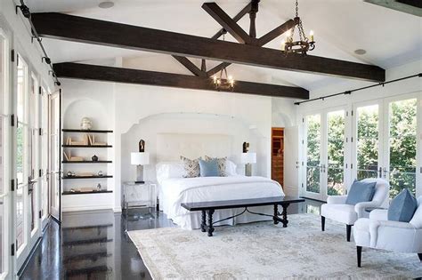 White Bedroom With Dark Wood Beam Ceiling Transitional