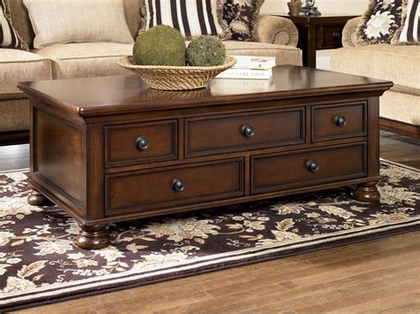 This coffee table is a large selection of decorative home goods, including area rugs, stair rugs elegant and sophisticated, our ashley coffee table quickly becomes the focal point of any room. Signature Design by Ashley Porter Storage Cocktail Table ...