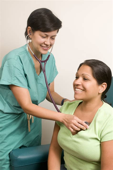 Dooctor Free Stock Photo A Female Doctor Examining A Patient 16288