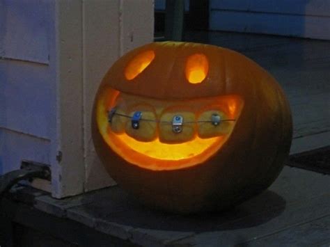 A Carved Pumpkin With Teeth On It