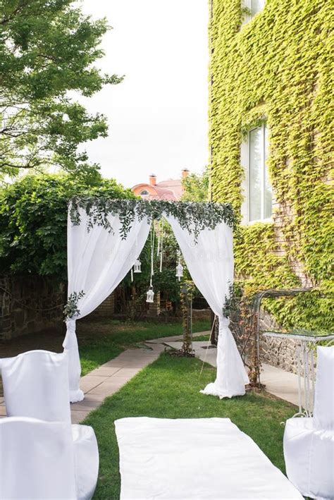 Beautiful Square Wedding Arch Decorated With White Material And