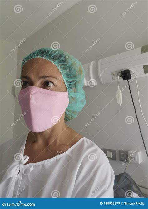 Female Surgeon Or Hospital Patient With Pink Mask In A Room Hospital To