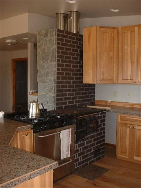 Another slightly less efficient method of heating water with your wood stove is to make a maze of threaded brass or stainless steel pipe fittings and lay them on top of the wood stove. Living Off Grid: Masonry Heaters | MOTHER EARTH NEWS