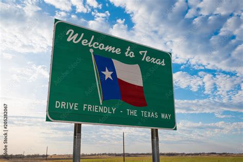 Welcome To Texas Road Sign In Front Of Cloudy Sky Stock Photo Adobe Stock