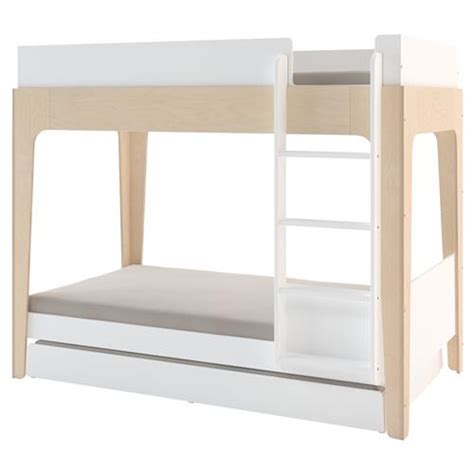 There is a lower bunk or tier and another bunk mounted above it to make another tier. Oeuf Perch Modern Classic Birch Twin Bunk Bed and Trundle Set