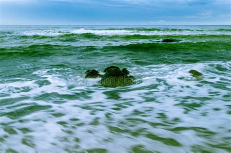 Large Boulder In Bluish Green Ocean Stock Image Image Of Mist Rock