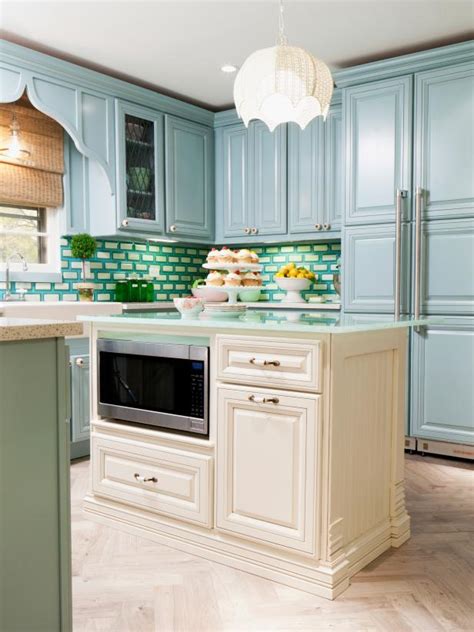 This post may contain affiliate links. Transitional Kitchen With Blue Cabinets and White Island ...