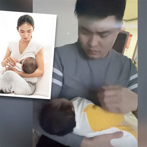 ‘don t laugh concerned husband showing wife how to correctly hold their newborn while