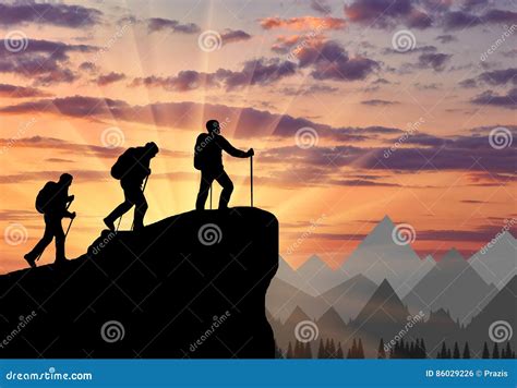 Silhouette Climbers Ascending To Top Of Mountain Stock Photo Image Of