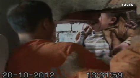 China Firefighters Save Woman Stuck Between Two Walls CNN