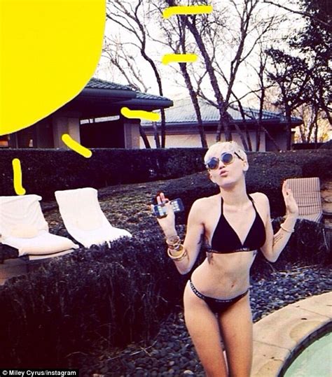 Miley Cyrus Displays Her Toned Bikini Body As She Slips Into A Skimpy