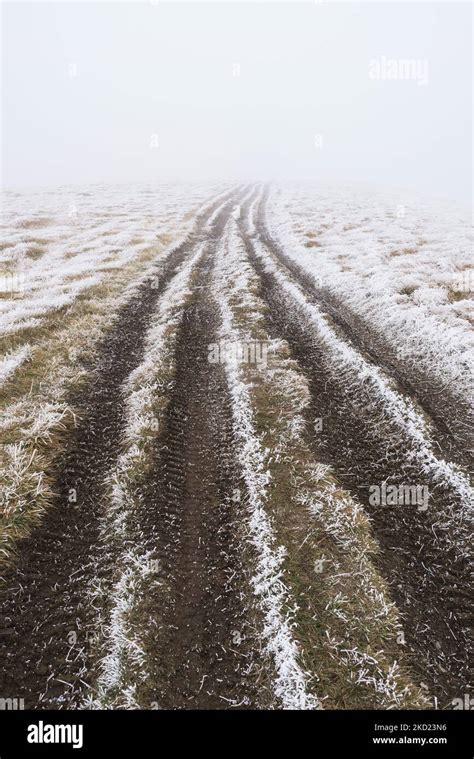 Dirt Road With Morning Frost On The Ground Stock Photo Alamy