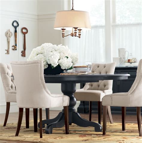 Reviewers mention that this table is both elegant if you like the idea of chairs that tuck in all the way but prefer a chair with a back, check out this round kitchen table. Love the black table paired with white tufted chairs! # ...