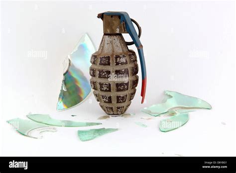 Grenade On Exploded Optical Disk Depicting Data Loss Stock Photo Alamy