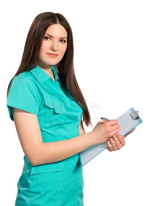Nurse Or Young Doctor In Uniform With Clipboard Writing Stock Photo