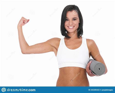 In Shape Feeling Great A Healthy Young Woman Smiling And Showing A