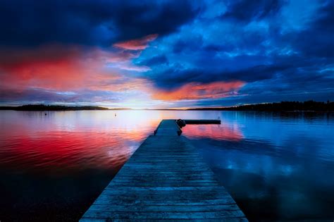 Boat Dock Station In Front Of Body Of Water Under Red And Blue Sky Hd