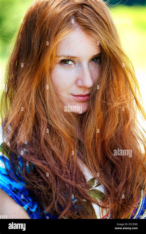 Portrait Of A Beautiful 20 Year Old Redhead Woman Outdoor Stock Photo