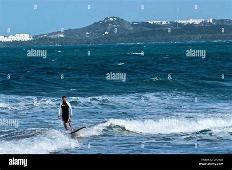 PUERTO RICO Caribbean Island Luquillo Beach By The Town Riding The Surf Stock Photo Alamy