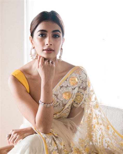 Pooja Hegde Looks Stunning As She Dons Shimmery Yellow Floral Saree