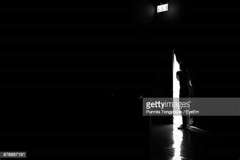 Man Standing Dark Room Photos And Premium High Res Pictures Getty Images