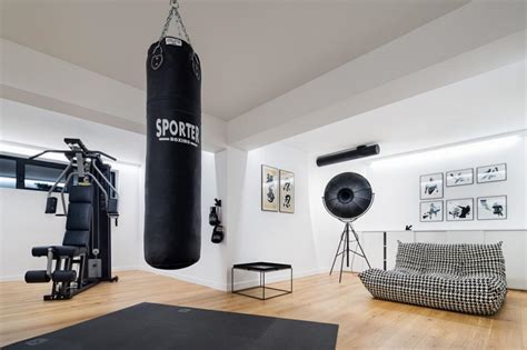 Contemporary Black and White Home Gym with Punching Bag | HGTV