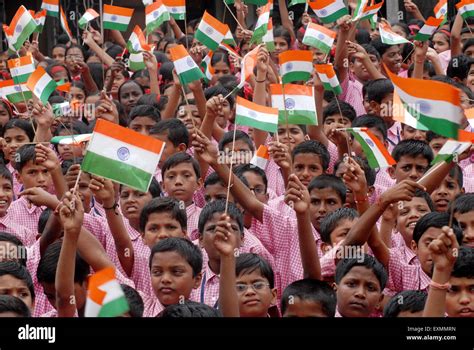 School Children Celebrate Indian Independence Day By Waving Indian Tri