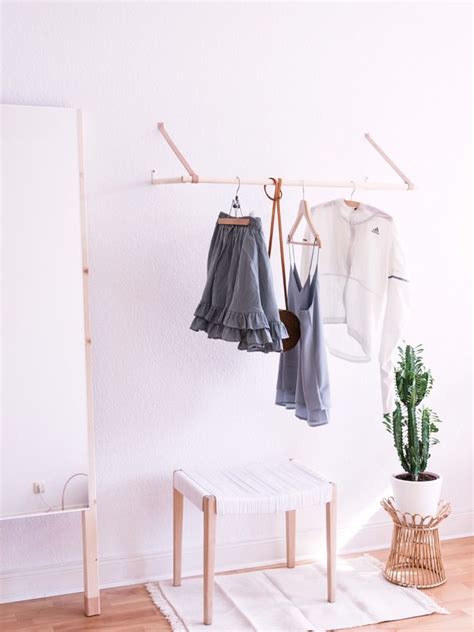 Ceiling mounted clothes rack are relatively pricey. How to DIY a Ceiling-Mounted Clothes Rack in 3 Easy Steps ...
