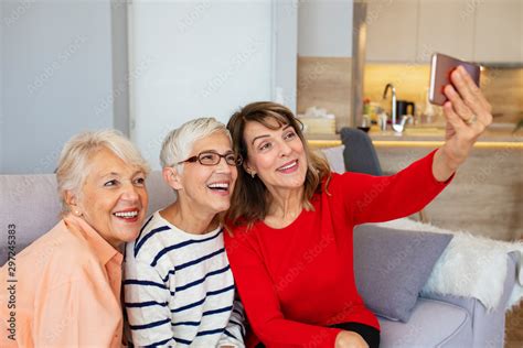 Beautiful Senior Women Having Fun Taking Selfies At Home Senior Friends Using A Phone Senior