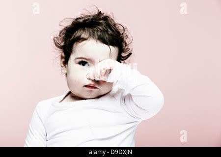 Portrait Of A Babe Girl Rubbing Her Eyes Stock Photo Alamy