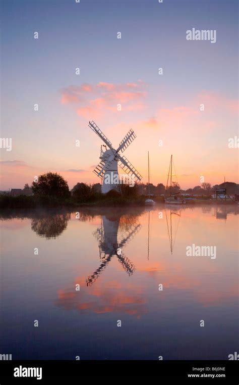 Thurne Windmill Photographed On A Clam Misty Morning At Sunrise On The