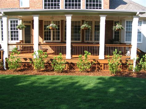 A Nice Expansive Open Back Porch With Square Columns Set Off This