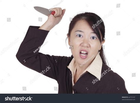 An Angry Asian Businesswoman Holding A Knife Stock Photo 64772107