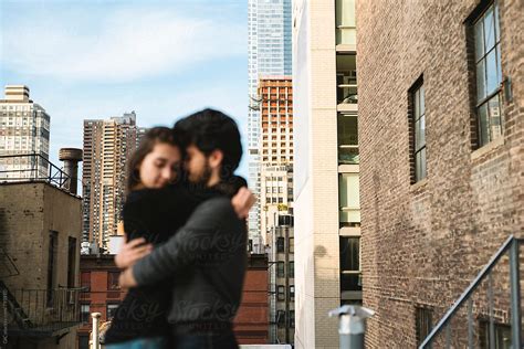 Couple Having Fun On A Rooftop In The City Del Colaborador De Stocksy Simone Wave Stocksy