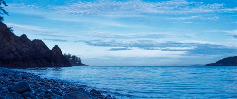 Download Wallpaper 2560x1080 Coast Stones Rocks Sea Landscape Dual