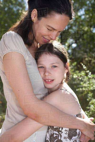 Mother And Daughter Embracing Stock Photo Dissolve