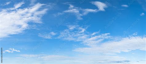 Panorama Of Blue Sky Background With White Clouds On A Sunny Day Stock