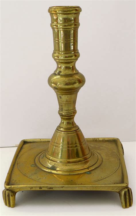 Early Lighting Antique Brass Candlestick With Footed Base Circa 1700