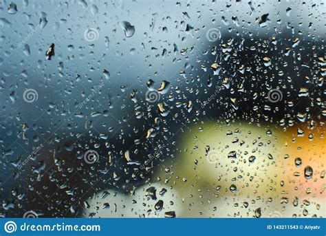Rain Drops On Window With Road Light Bokeh Background Stock Image