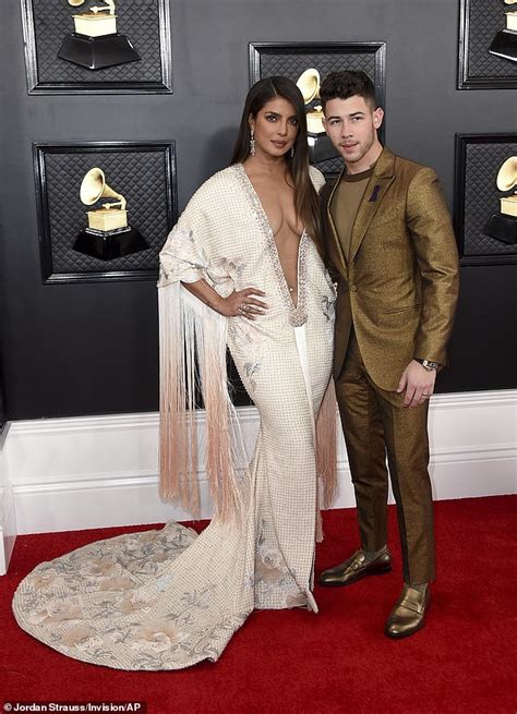 I'm not sure where to even begin with her side of the picture. Priyanka Chopra wows at the Grammy Awards in plunging gown ...