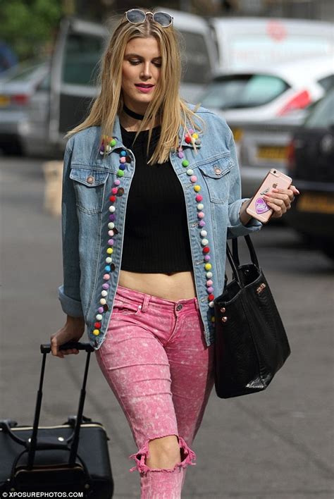 Ashley James Flashes Her Stomach In A Bright And Pom Pom Jacket With