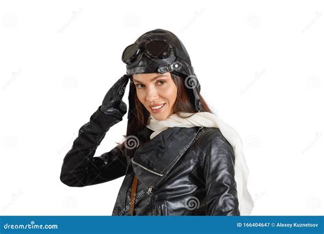 Portrait Of An Attractive Brunette Girl In Retro Pilot Costume Giving Military Salute Stock
