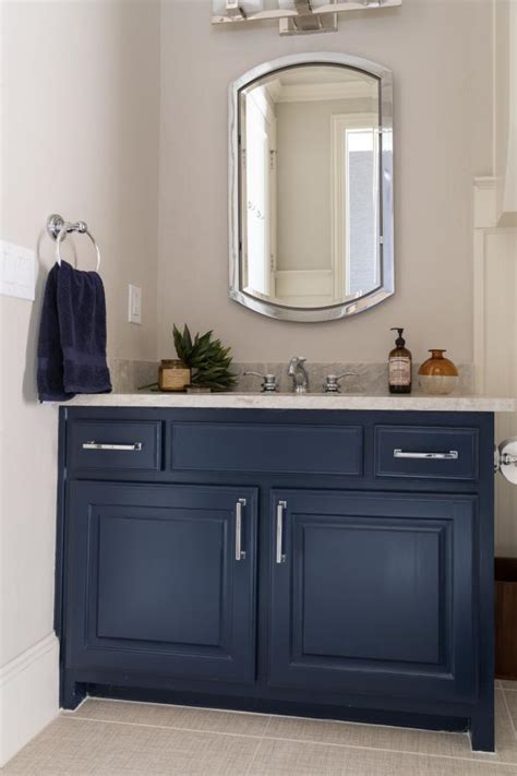 Blue, and most especially navy, evoke a nautical air that suits the bathroom abode extremely well. Navy Blue Bathroom Vanity Steals the Show | HGTV